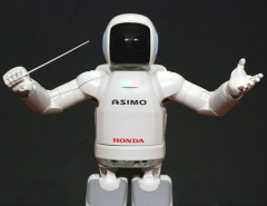 ASIMO, created by Honda, is a humanoid robot that is able to walk and interact with humans